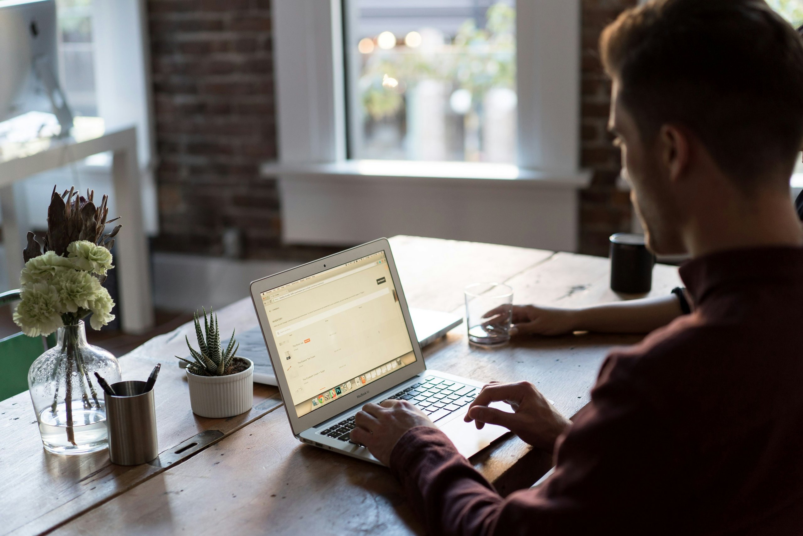 Business owner reviewing financial documents with advisor during uncertain economic times